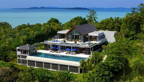 an aerial view of a house with a swimming pool at Kon Sang Villa in Patong Beach