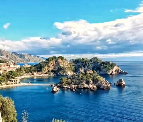 a group of islands in the water on a sunny day at Casa Marina Taormina in Taormina