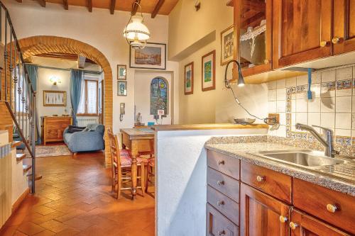 a kitchen with a sink and a counter top at Renaissance Apartment in Pienza