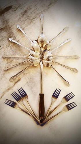a clock made out of utensils and forks at Puchong Semi D Homestay spacious 4 rooms in Puchong