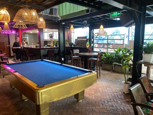 a pool table in the middle of a restaurant at Rom Casa Hostel Da Nang in Da Nang