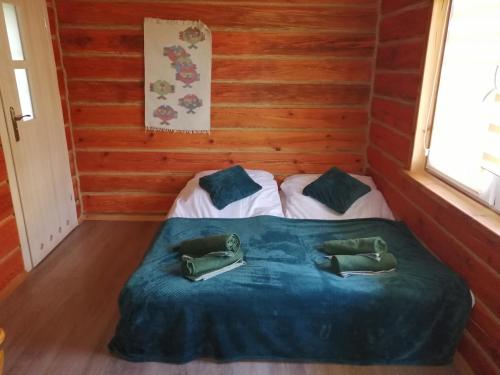 a small room with a bed in a cabin at Radawa Family Space in Radawa