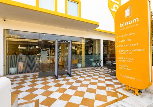 a store with a checkered floor in front of a building at Bloom Hotel - Golf Course Road, Sector 43 in Gurgaon