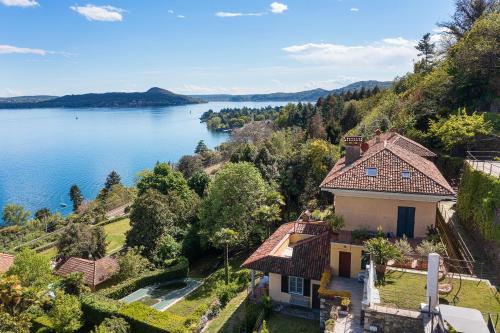 an aerial view of a house on a hill next to a lake at Apartment Merida in Belgirate