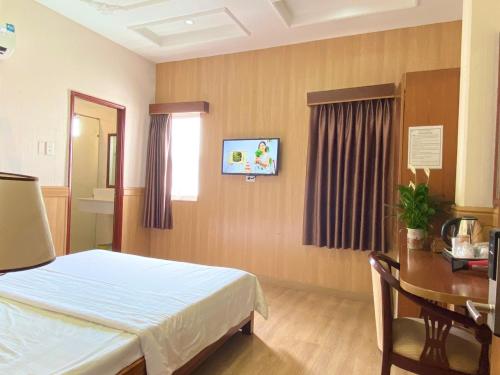 Postel nebo postele na pokoji v ubytování Nhu Y Hotel