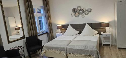 Hotelbetriebe Güldenhaupt GmbHにあるベッド