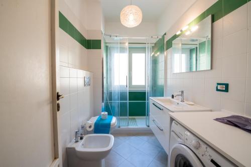 a bathroom with a toilet and a sink and a shower at Casa Labertino in Rome