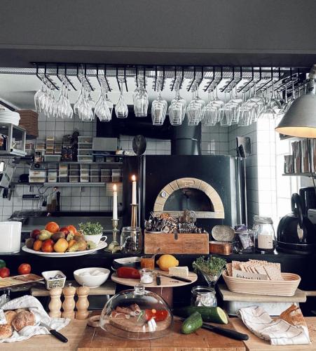 a kitchen with a bunch of food on a counter at Pensionatet in Piteå