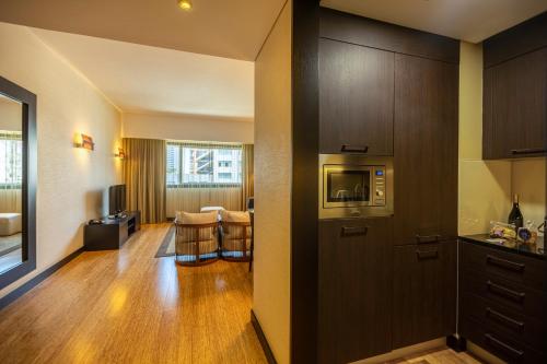  EPIC SANA Luanda Hotel -  Room  picture :   Tea/Coffee maker    Minibar    Bath                           