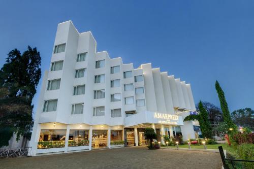 a rendering of the amazonilus hotel at dusk at Amarpreet, Chhatrapati Sambhajinagar - AM Hotel Kollection in Aurangabad