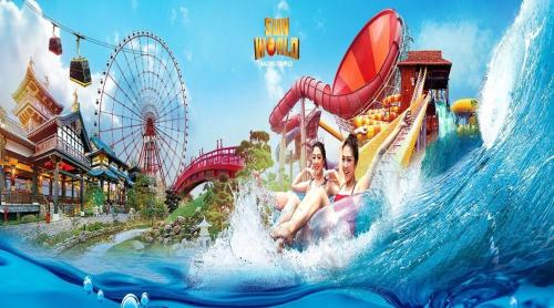 two people riding a roller coaster in a water park at Tình Hiếu Hotel in Ha Long