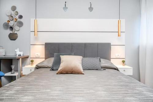 A bed or beds in a room at Apartman Megi