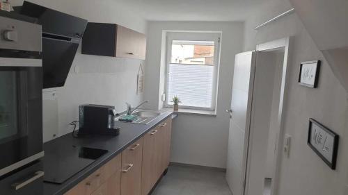 Kuchyň nebo kuchyňský kout v ubytování Ferienhaus Im Gäßchen
