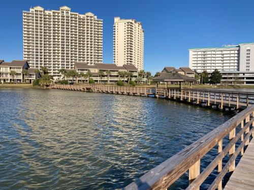 a bridge over a river with buildings in the background at Ariel Dunes II 204 - Miramar Beach in Destin