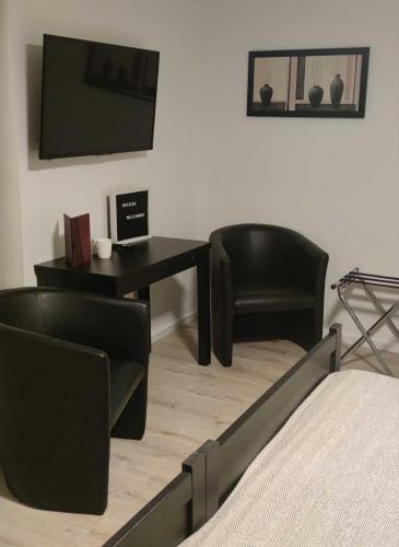 Hotelbetriebe Güldenhaupt GmbHにあるテレビまたはエンターテインメントセンター