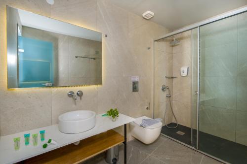 a bathroom with a toilet and a sink and a shower at Balos Beach in Kissamos