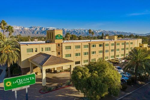 a hotel building with a sign in front of it at La Quinta by Wyndham Tucson - Reid Park in Tucson