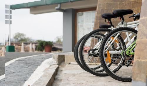 a couple of bikes parked next to a building at Polo Cherrapunjee Resort in Cherrapunji