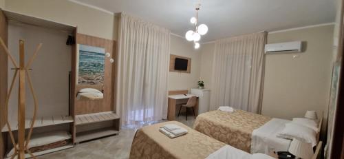 Postel nebo postele na pokoji v ubytování Hotel Sole