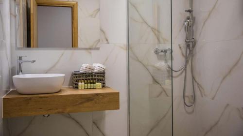 a bathroom with a sink and a shower at Stylish villa near Dubrovnik with a swimming pool in Mlini