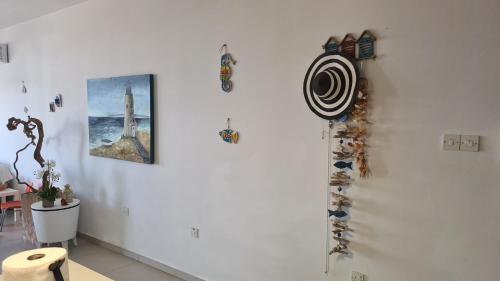 a white wall with a bunch of magnets on it at STAY Kapparis View Apartment in Paralimni