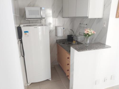 A kitchen or kitchenette at Apartamento Liberdade