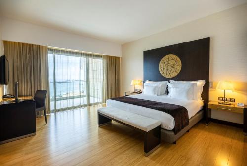  EPIC SANA Luanda Hotel -  Room  picture :   Minibar    Bath    Safety deposit box                           