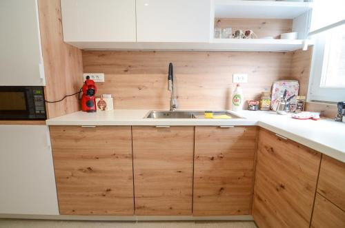 Kuchyň nebo kuchyňský kout v ubytování Sunset Square Apartment Sarajevo
