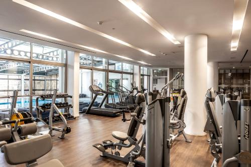 a gym with treadmills and cardio equipment in a building at Pavlo Napa Beach Hotel in Ayia Napa