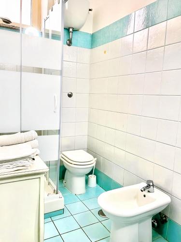 a bathroom with a toilet and a sink at Locazione Turistica Misano in Monte di Procida