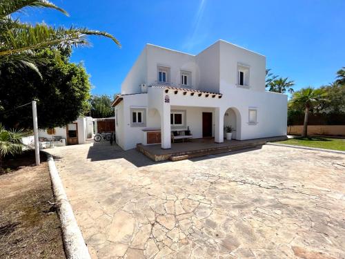 a large white house with a driveway at Celebrate Life's Precious Moments at Can Saca! in Sant Jordi