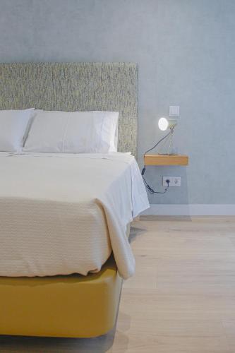 Кровать или кровати в номере Casal da Penha Apartments