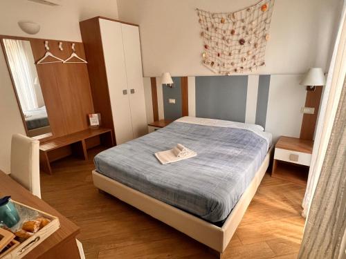 Ένα ή περισσότερα κρεβάτια σε δωμάτιο στο Nada Mas