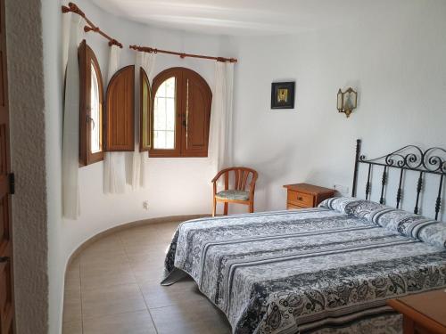 A bed or beds in a room at Casa Juanita