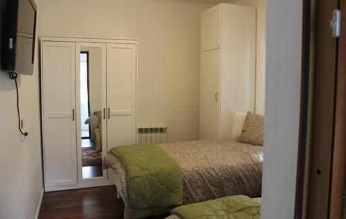 a bedroom with a bed and a door to a hallway at Sundsvall lägenhet in Sundsvall