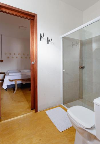 a bathroom with a shower and a toilet and a sink at Casa Sibite - Ilha do Ferro in Pão de Açúcar