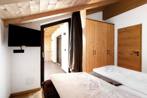 Una cama o camas en una habitación de Platiederhof Apt Lajen