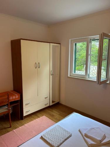 Ένα ή περισσότερα κρεβάτια σε δωμάτιο στο Apartments Matusko