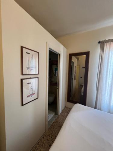 Postel nebo postele na pokoji v ubytování Locanda Lorena