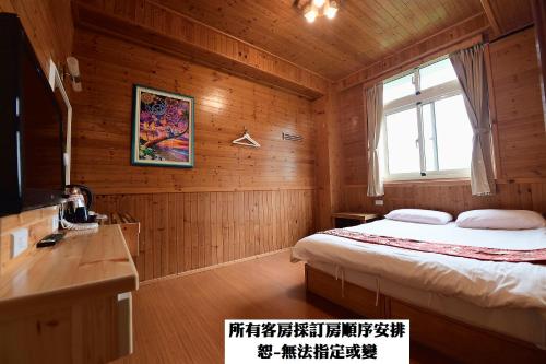 Voodi või voodid majutusasutuse 溪頭桂竹山莊民宿 toas
