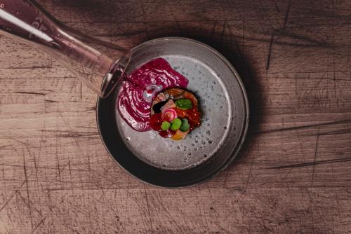 a bowl of food sitting on top of a table at Romantik Hotel Gasthaus Rottner in Nürnberg