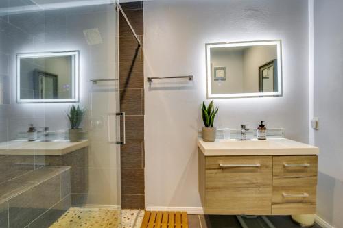 a bathroom with a shower and a sink and a mirror at Palm Desert Vacation Rental with Private Pool and Spa! in Palm Desert
