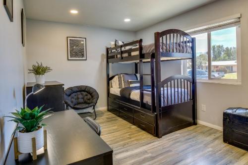 a room with two bunk beds and a desk at Palm Desert Vacation Rental with Private Pool and Spa! in Palm Desert