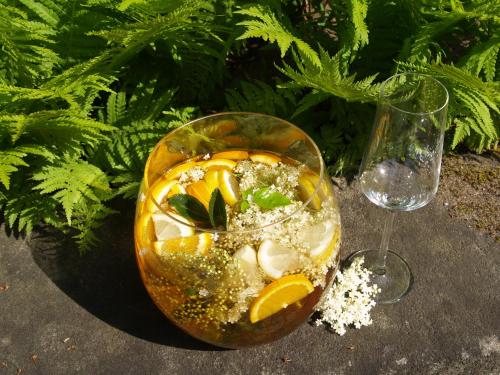 a glass bowl of food next to a wine glass at Romantik Hotel Gasthaus Rottner in Nürnberg