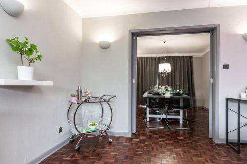 a living room with a chair and a table at City home with parking and garden- pet friendly in Chester