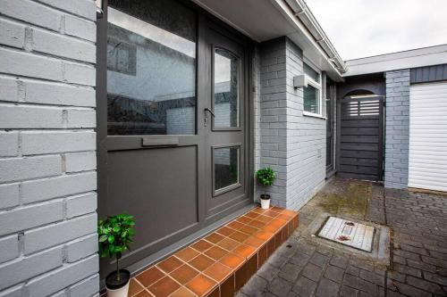 a front door of a house with a brick porch at City home with parking and garden- pet friendly in Chester