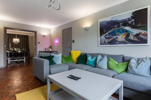 a living room with a couch and a table at City home with parking and garden- pet friendly in Chester