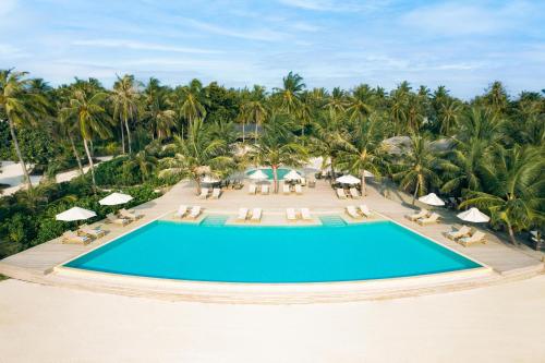 an aerial view of a pool at a resort at Jawakara Islands Maldives in Lhaviyani Atoll