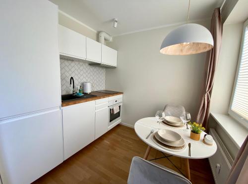 Virtuvė arba virtuvėlė apgyvendinimo įstaigoje Modern Smuuli apartment