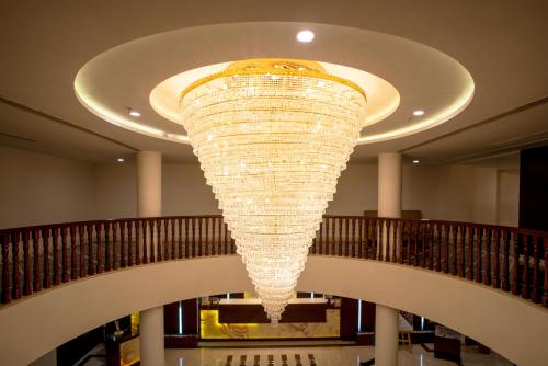 a large chandelier hanging from the ceiling in a building at Spectrum Resort, Spa & Residences in Udaipur